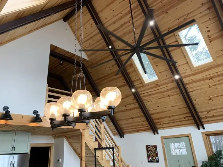 Recessed lighting installation in Asheville: layered a vaulted beam ceiling with a statement fixture, warm and dimmable